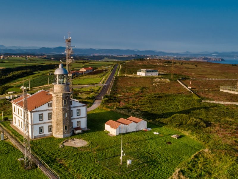 Aerial Photograph of Cabo de Peñas with the lighthouse and cliffs. Asturias Spain.